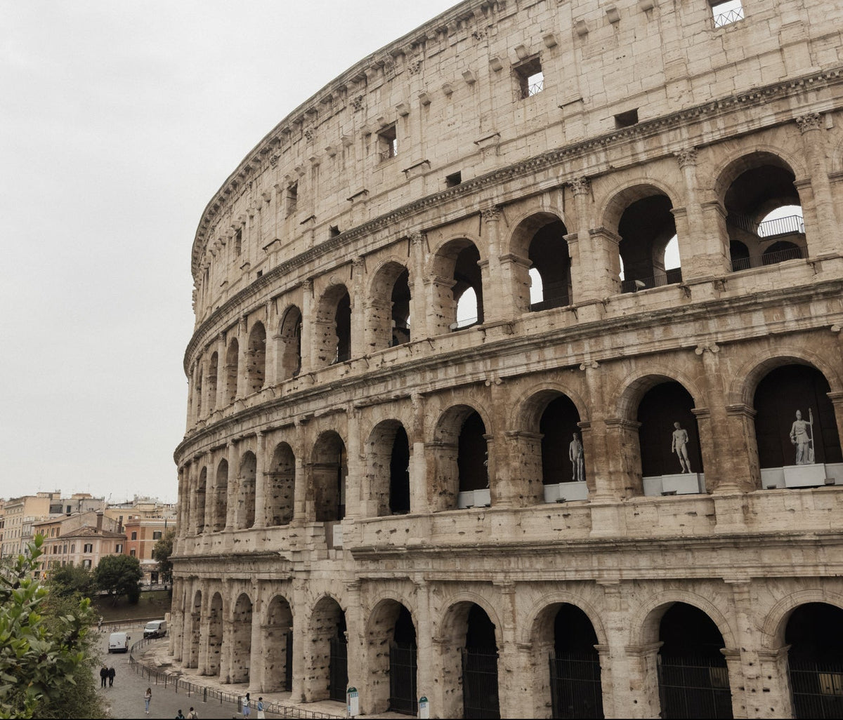 The ancient stone arches of the Colosseum in Rome, Italy
