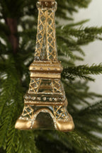 Close-up of the gold painted lattice, glitter bands and gold platform on the glass Eiffel Tower ornament