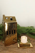 Spout-gable gold canal house tealight holder lifted off its base to show where the tealight sits