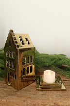 Stepped-gable gold canal house tealight holder lifted off its base to show where the tealight sits