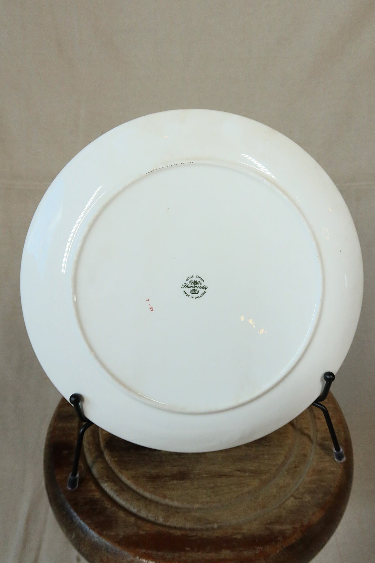 Back of the Hammersley Christmas market plate showing the white bone china underside, foot ring and backstamp
