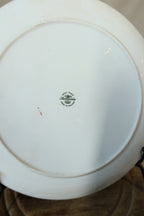 Close-up of the green Hammersley Bone China Made in England backstamp with acorn and crown, and a small red painted number
