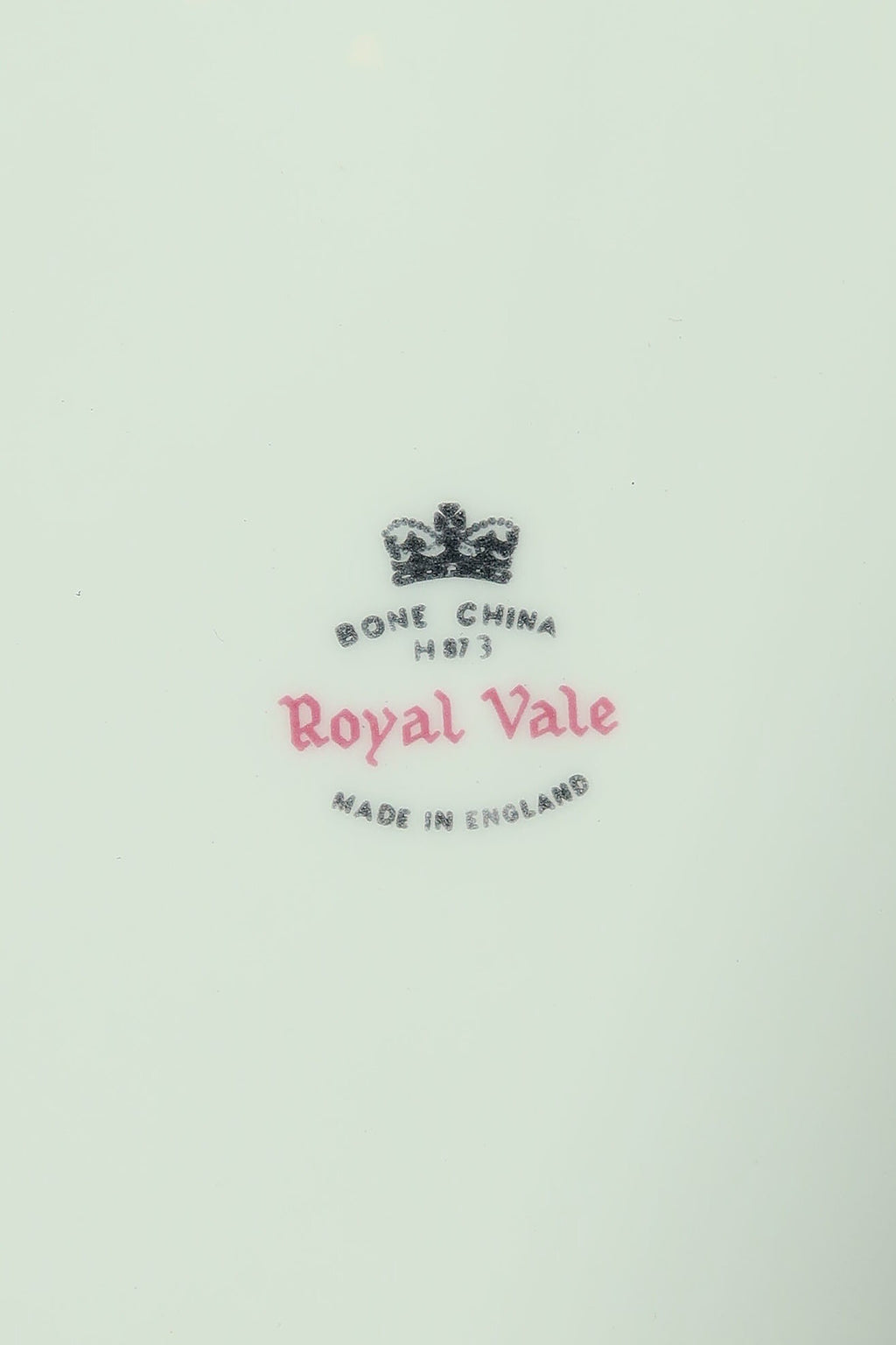 Close-up of the Royal Vale Bone China Made in England backstamp with black crown and pink Royal Vale script