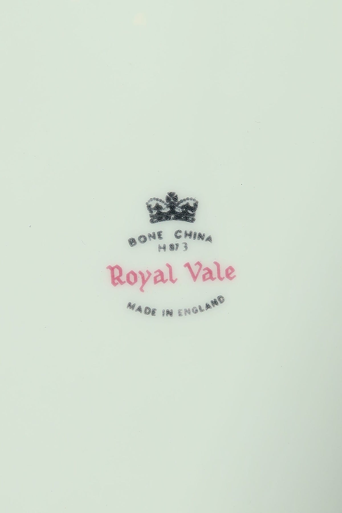 Close-up of the Royal Vale Bone China Made in England backstamp with black crown and pink Royal Vale script