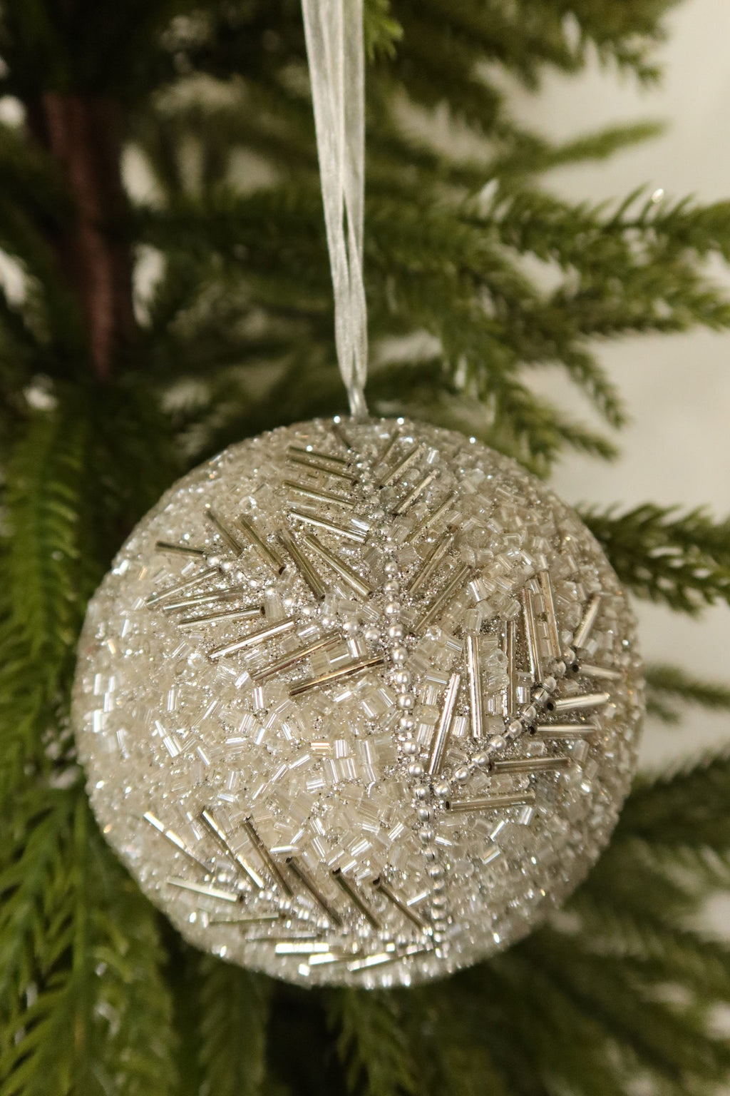 Close-up of the sparkling silver bugle beads, seed beads and pearl bead branches covering the ball ornament