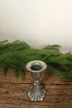 Top view of the 3 in silver cast iron taper candle holder showing the candle cup and flared rim
