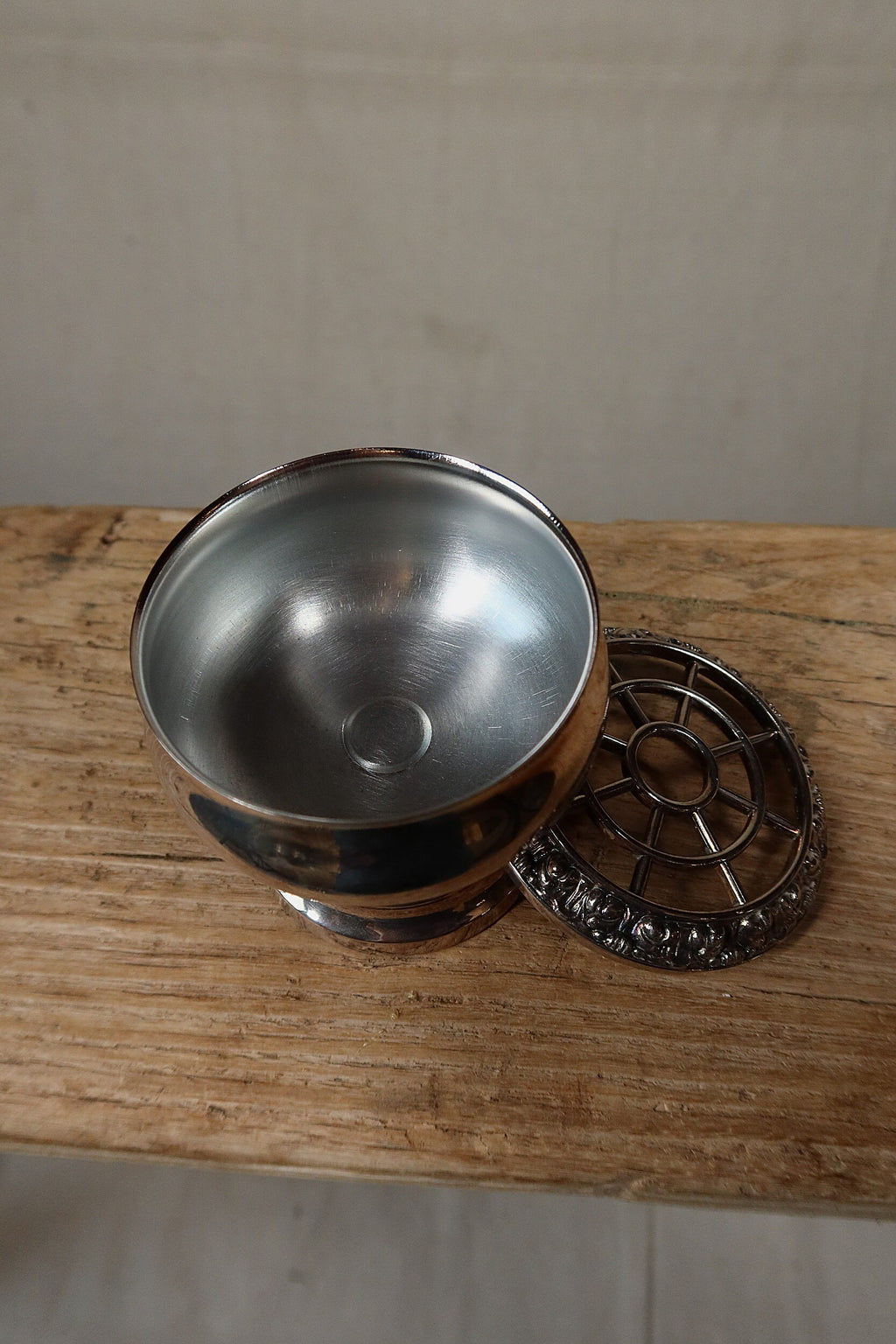 Inside of the Ianthe silver plate rose bowl with the pierced grille resting alongside