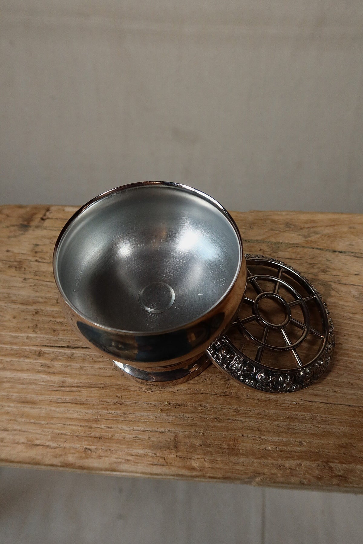 Inside of the Ianthe silver plate rose bowl with the pierced grille resting alongside